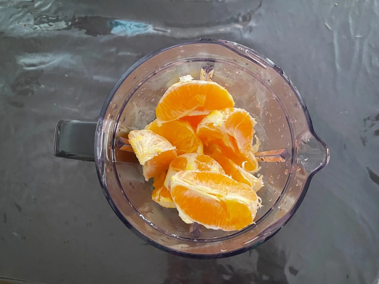Step 1: After peeling, cut each orange into quarters. This makes blending easier and faster. Then 